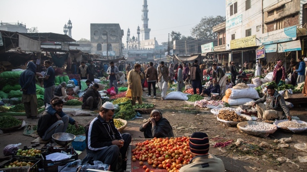 Vendors and visitors at a market in Lahore, Pakistan, on Monday, Dec. 13, 2021. The government wants to spend $7 billion to develop the Ravi riverbank, but opponents say that risks replicating the environmental and societal problems in nearby Lahore. Photographer: Betsy Joles/Bloomberg