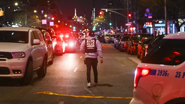 Police lock down the scene after two NYPD officers were shot in Harlem on Jan. 21, 2022.