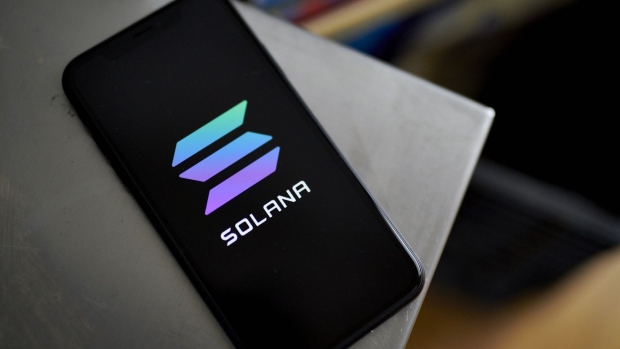 The Solana logo on a smartphone arranged in the Brooklyn Borough of New York, U.S., on Saturday, July 31, 2021. The Senate's bipartisan infrastructure deal envisions imposing stricter rules on cryptocurrency investors to collect more taxes to fund a portion of the $550 billion investment into transportation and power systems. Photographer: Gabby Jones/Bloomberg