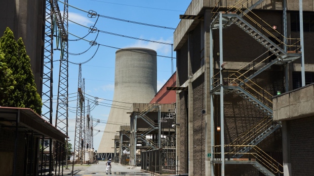 A cooling tower at the Eskom Holdings SOC Ltd. Tutuka coal-fired power station in Mpumalanga, South Africa, on Thursday, Nov. 18, 2021. South Africa's energy department has said it will start preparing for the end of coal-for-power use in the country but cautioned that a retreat from the dirtiest fossil fuel must take account of the impact on the economy and the people who depend on it for a living. Photographer: Waldo Swiegers/Bloomberg