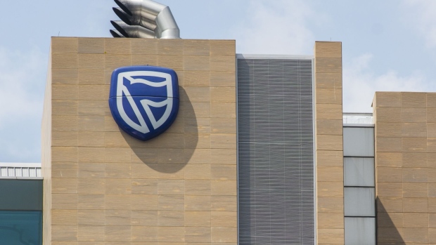 A logo sits on display outside the offices of Standard Bank Group Ltd. bank in Johannesburg, South Africa, on Wednesday, Sept. 23, 2020. South Africa’s biggest lenders were faced with the pressing need to raise provisions to protect against souring loans, while demand for credit slumped as the coronavirus lockdown took a toll on business customers. Photographer: Waldo Swiegers/Bloomberg