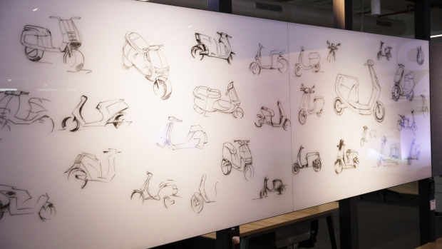 Sketches of the Ola electric scooter during the vehicle's launch at the Ola Campus in Bengaluru, India, on Sunday, Aug. 15, 2021. Ola Electric Mobility Pvt priced its electric scooter at 99,999 rupees ($1,348) in an attempt to crack the affordability barrier for electric two-wheelers in value-conscious India. Photographer: Samyukta Lakshmi/Bloomberg