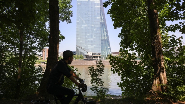 A cyclist rides past the European Central Bank (ECB) headquarters beside the River Main in Frankfurt, Germany, on Thursday, June 17, 2021. European Central Bank Chief Economist Philip Lane signaled that policy makers may not have all the data they need by September to start shifting policy away from the current ultra-loose stance.