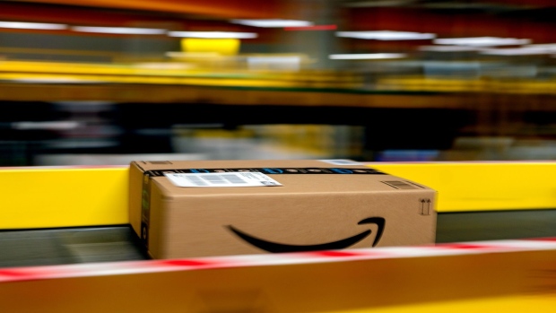 An Amazon Prime parcel passes along a conveyor at an Amazon.com Inc. fulfillment center in Frankenthal, Germany, on Tuesday, Oct. 13, 2020. Amazon's two-day Prime Day sale kicks off on Tuesday and is expected to give the world’s largest e-commerce company an early advantage over brick-and-mortar rivals still contending with pandemic-spooked consumers wary of battling Black Friday crowds. Photographer: Thorsten Wagner/Bloomberg