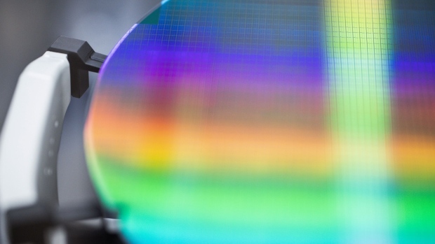 A 300 millimetre silicon wafer during the manufacturing process inside the new Infineon Technologies AG chip factory in Villach, Austria, on Thursday, Sept. 16, 2021. Infineon Chief Executive Officer Reinhard Ploss said the fully automated factory is expected to generate revenue of €2 billion per year. Photographer: Akos Stiller/Bloomberg