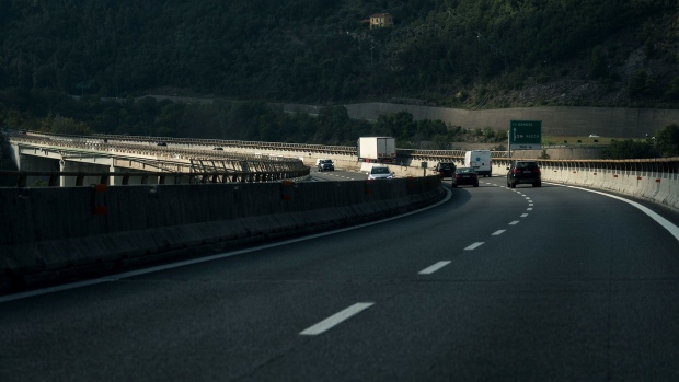 Traffic moves along the A12 Highway operated by Autostrade per l'Italia SpA, near Genoa, Italy. Photographer: Federico Bernini/Bloomberg