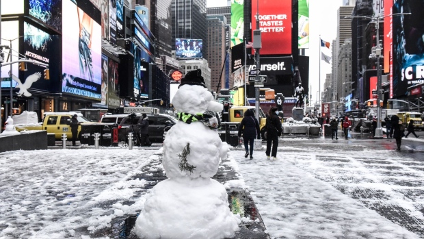 A snowman in Times Square during a snow storm in New York, U.S., on Friday, Jan. 7, 2022. New York City experienced its first snow storm of the winter season with accumulations up to four inches in midtown Manhattan.