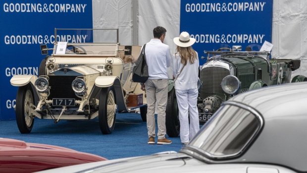 Attendees view vehicles for auction during the Gooding & Co. auction at the 2021 Pebble Beach Concours d'Elegance in Pebble Beach, Calif. Photographer: David Paul Morris/Bloomberg