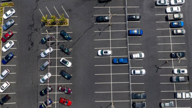 Vehicles in a nearly empty lot at a car dealership in Richmond, California, U.S., on Thursday, July 1, 2021. The global semiconductor shortage that hobbled auto production worldwide this year is leaving showrooms with few models to showcase just as U.S. consumers breaking free of pandemic restrictions are eager for new wheels.