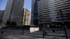 A pedestrian walks outside the Toronto-Dominion (TD) Centre in the financial district of Toronto, Ontario, Canada, on Friday, May 22, 2020. Whether the PATH, a subterranean network that provides connections between major commuter stations, over 80 properties, including the headquarters of Canada's five largest banks, and 1,200 retail spots, can return to its glory days will depend initially on how quickly Bay St. firms return workers to their offices.
