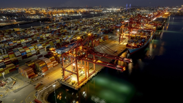 Cargo ships are unloaded at the Port of Long Beach in Long Beach, California. Photographer: Kyle Grillot/Bloomberg