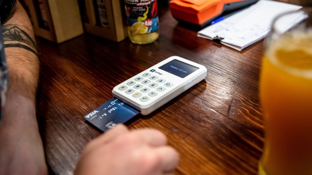 A customer uses a SumUp Payments Ltd. 3g card reader payment device at the Taproom Oitava Colina in the Marvila district of Lisbon, Portugal, on Friday, Sept. 13, 2019. Portugal is western Europe's most dynamic property market thanks to tax incentives for foreign buyers and a so-called golden visa program, which offers residence permits in return for a minimum 500,000-euro ($550,000) investment.
