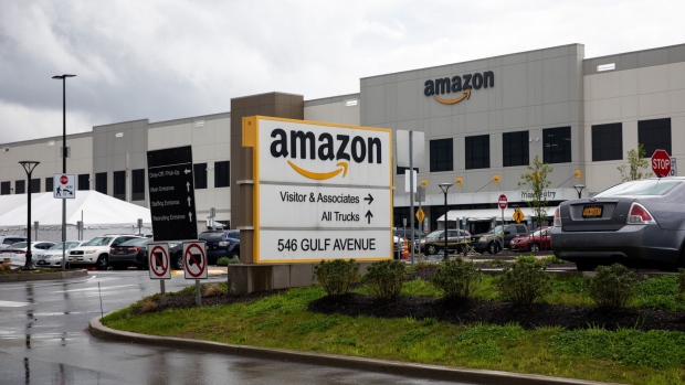 Signage is displayed outside the Amazon.com Inc. facility in the Staten Island borough of New York, U.S., on Friday, May 1, 2020. Workers at Amazon, Whole Foods, Instacart, Walmart, FedEx, Target, and Shipt said they would walk off the job to protest their employers' failure to provide basic protections for employees who are risking their lives at work.