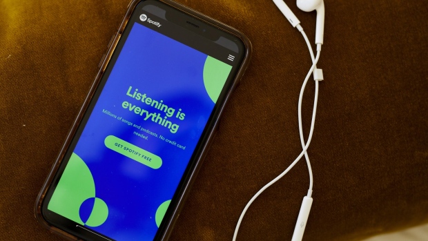 The website home screen for Spotify is displayed on a smartphone in an arranged photograph taken in Little Falls, New Jersey, U.S., on Thursday, Oct. 8, 2020. Spotify has invested hundreds of millions of dollars acquiring podcast studios such as Gimlet Media and the Ringer, hoping to attract new users and advertisers to what has been a music app.