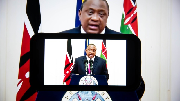 Uhuru Kenyatta, Kenya's president, speaks in a prerecorded video during the United Nations General Assembly via live stream in New York, U.S., on Wednesday, Sept. 22, 2021. A scaled-back United Nations General Assembly returns to Manhattan after going completely virtual last year, but fears about a possible spike in Covid-19 cases are making people in the host city less enthusiastic about the annual diplomatic gathering. Photographer: Michael Nagle/Bloomberg