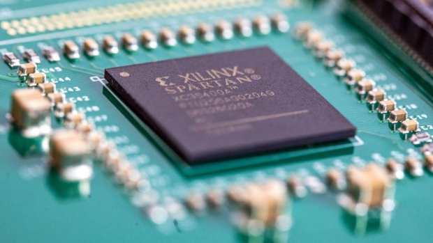 A Spartan FPGA (Field Programmable Gate Array) integrated circuit microchip (IC), manufactured by Xilinx Inc., on a printed circuit board (PCB) at CSI Electronic Manufacturing Services Ltd. in Witham, U.K., on Wednesday, April 28, 2021. The global chip shortage is going from bad to worse with automakers on three continents joining tech giants Apple Inc. and Samsung Electronics Co. in flagging production cuts and lost revenue from the crisis.