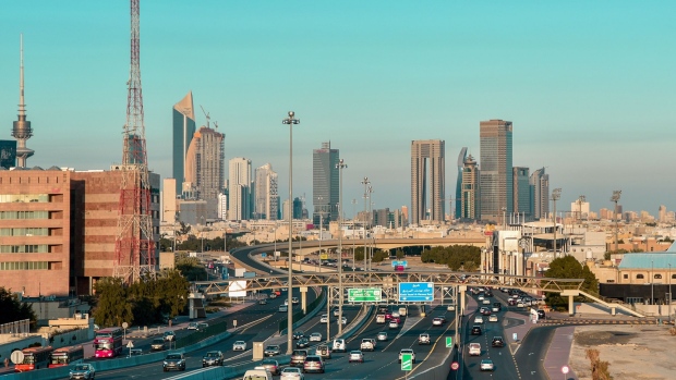 Vehicles travel along Jahra Road towards central Kuwait City, Kuwait, on Sunday, Jan. 9, 2022. Global warming is smashing temperature records all over the world, but Kuwait — one of the hottest countries on the planet — is fast becoming unlivable.