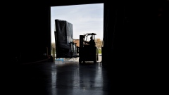 A worker uses a forklift to move packages at a robotics facility in Baltimore. Photographer: Andrew Harrer/Bloomberg