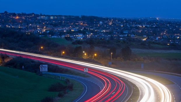 Traffic light trails on the A27 dual carriageway in Brighton, U.K. Photographer: Chris Ratcliffe/Bloomberg