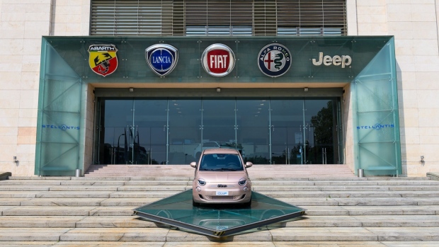 A Fiat 500 automobile outside an entrance at the Mirafiori car plant, that served as the headquarters of Fiat Chrysler Automobiles NV, now part of Stellantis NV, in Turin, Italy.