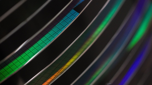 A rack of 300 millimetre silicon wafers during the manufacturing process inside the new Infineon Technologies AG chip factory in Villach, Austria. Photographer: Akos Stiller/Bloomberg