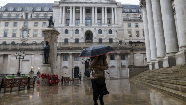 A pedestrian walks past the Bank of England in the City of London, U.K., on Tuesday, Jan. 4, 2022. Bankers in London are expecting to start the year at home after the U.K. government recommended a shift to more remote work on Dec. 8, leaving the city quiet even before the Christmas break. Photographer: Hollie Adams/Bloomberg