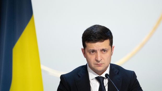 Volodymyr Zelenskiy, Ukraine's president, pauses during a news conference following a 4-way summit on Ukraine at Elysee Palace in Paris, France, on Monday, Dec. 9, 2019. Russian President Vladimir Putin and Zelenskiy breathed new life into efforts to end the violence in eastern Ukraine, agreeing at a summit in Paris on Monday to a fresh exchange of prisoners and the withdrawal of some troops.