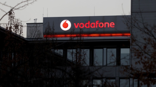 A Vodafone Group Plc logo company's offices in Berlin, Germany, on Wednesday, Feb. 24, 2021. Vodafone plans to float a minority stake of its European towers unit Vantage Towers AG in Frankfurt, setting up what could be one of the region’s biggest initial public offerings this year. Photographer: Liesa Johannssen-Koppitz/Bloomberg