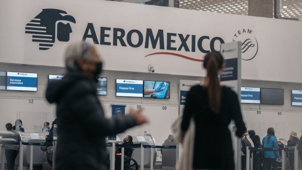 Aeromexico signage at Benito Juarez International Airport (MEX) in Mexico City, Mexico, on Monday, Jan. 10, 2022. Travelers at Mexico City’s airport on Friday had to withstand lines that stretched far outside the hub’s doors and onto the sidewalk just to drop off their bags as airlines were hit with staffing shortages due to Covid-19. Photographer: Jeoffrey Guillemard/Bloomberg