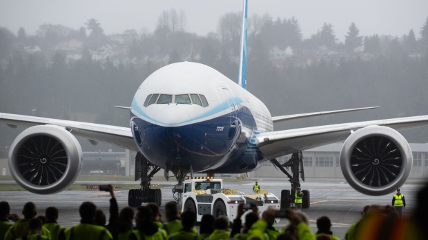A Boeing Co. 777X airplane sits at the Boeing Field in Seattle, Washington, U.S., on Saturday, Jan. 25, 2020. Boeing's newest plane is preparing to spread its gargantuan wings—so long the tips are hinged—and rumble into the skies over the Washington factory complex constructed a half century ago for the original jumbo jet.