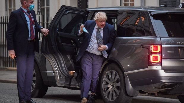 Boris Johnson, U.K. prime minster, arrives in Downing Street in London, U.K., on Tuesday, Jan. 25, 2022. The crisis engulfing Johnson escalated dramatically after the police began formally investigating allegations he and his staff held parties that broke the government’s pandemic rules.