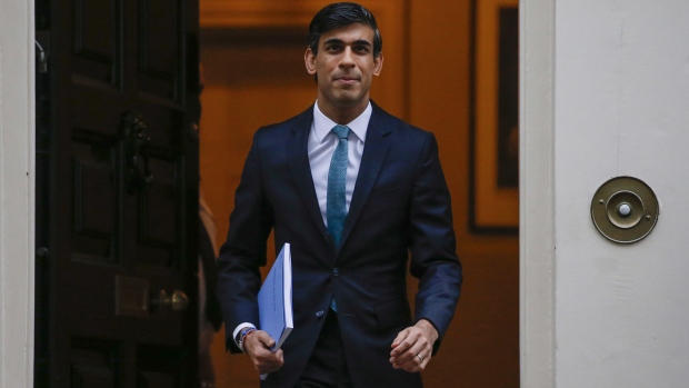Rishi Sunak, U.K. chancellor of the exchequer, departs Downing Street ahead of the presentation of spending plans at Parliament, in London, U.K., on Wednesday, Nov. 25, 2020. Sunak will likely perform a balancing act between supporting the recovery in the near term while also signaling there's a repair job to be done on the public finances in the medium term.