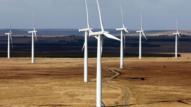A wind farm stands in the Sutherland area of Scotland, U.K., on Wednesday, March 22, 2017. Generating power from new onshore wind farms would be 100 million pound a year cheaper than doing so from new nuclear reactors or biomass plants, and at least 30 million pounds cheaper than under the latest offshore wind-power contracts, according to research by the Energy & Climate Intelligence Unit, a London-based non-profit group.v Photographer: Chris Ratcliffe/Bloomberg
