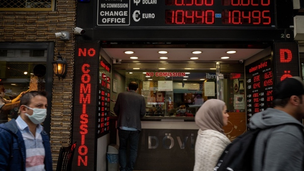 A customer uses a currency exchange bureau in Istanbul, Turkey, on Wednesday, June 2, 2021. Turkish President Recep Tayyip Erdogan renewed calls for lower interest rates despite elevated inflation, sending the lira to a fresh low against the dollar and prompting the central bank governor to push back against expectations of an imminent move.