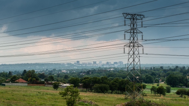 Electrical power lines hang from transmission pylons in Johannesburg, South Africa, on Tuesday, Dec. 18, 2018. Companies such as power utility Eskom, South African Airways and the South African Broadcasting Corp. are reeling after repeated management and strategy bungles and have indicated they need state aid and staff cuts to survive.