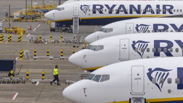 Passenger aircraft, operated by Ryanair Holdings Plc, on the tarmac at London Stansted Airport, operated by Manchester Airport Plc, in Stansted, U.K., on Monday, Jan. 10, 2022. The U.K. will no longer require vaccinated travelers to take a Covid-19 test before boarding a flight to the country, after airlines hard-hit by the omicron variant lobbied for the rules to be eased. Photographer: Jason Alden/Bloomberg