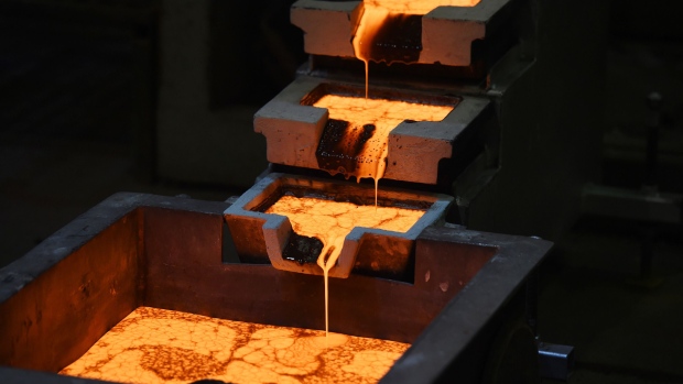 Molten gold is poured into molds at the Norton Gold Fields Ltd. Paddington operations 35 kilometers north-west of Kalgoorlie, Australia.