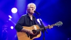 CAMBRIDGE, ENGLAND - AUGUST 02: Graham Nash performs on stage during the Cambridge Folk Festival 2019 at Cherry Hinton Hall on August 02, 2019 in Cambridge, England. (Photo by Jeff Spicer/Getty Images)