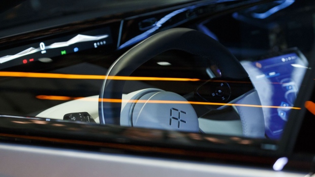 The Faraday Future logo is displayed on the steering wheel of the FF91 electric car unveiled at the 2017 Consumer Electronics Show (CES) in Las Vegas, Nevada, U.S., on Tuesday, Jan. 3, 2017. Faraday Future staked its claim to the world's fastest electric car with its FF91 production model, showing footage of it outracing Tesla Motors Inc.'s Model S in a glitzy event in Las Vegas. Photographer: Patrick T. Fallon/Bloomberg