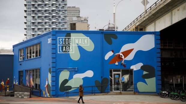 A pedestrian walks past Sidewalk Labs headquarters near the proposed site of 'Quayside' in Toronto, Ontario, Canada, on Thursday, May 7, 2020. Sidewalk Labs LLC, Alphabet’s urban innovation unit and sister to Google, is shelving its plan to build an urban digital neighborhood due to unprecedented economic uncertainty globally and in the Toronto real estate market, Chief Executive Officer Dan Doctoroff said in a blog post Thursday.