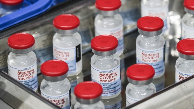 Vials of the Moderna Inc. Covid-19 vaccine at a vaccination site inside a gymnasium in San Juan City, Metro Manila, the Philippines, on Tuesday, Dec. 28, 2021. The Philippines has shortened the interval for administering Covid-19 vaccine boosters amid the threat of the omicron variant.