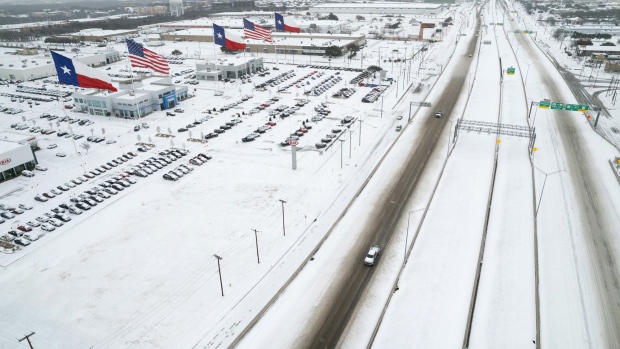 Traffic moves through snow and ice on U.S. Route 183 in Irving, Texas on Feb. 3.