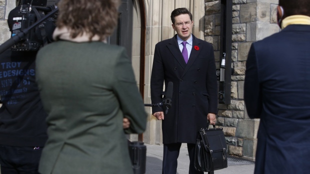 Pierre Poilievre, a member of Parliament, speaks to members of the media outside of West Block on Parliament Hill in Ottawa, Ontario, Canada, on Friday, Nov. 6, 2020. Prime Minister Justin Trudeau said he won't weigh in on the 2020 U.S. Presidential election until the outcome becomes "sufficiently clear," CBC News reported.