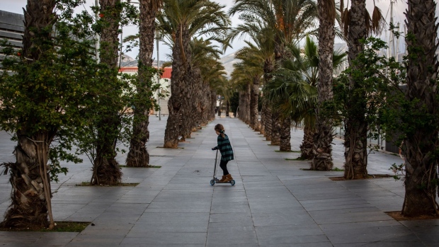 A child rides a scooter in Cartagena, Spain, on Friday, Jan. 28, 2022. Spanish inflation slowed less than expected in January, highlighting the challenge for policy makers as soaring energy prices weigh on consumers. Photographer: Angel Garcia/Bloomberg