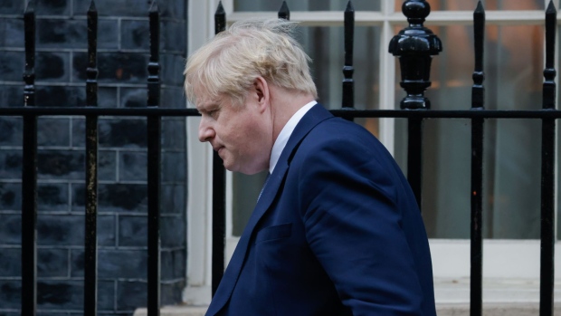 Boris Johnson, U.K. prime minster, departs from number 10 Downing Street on his way to make a statement in Parliament, following the release of the Sue Gray report, in London, U.K., on Monday, Jan. 31, 2022. The major report into allegations of rule-breaking gatherings in Downing Street has found “failures of leadership and judgment” at the top of Johnson’s government. Photographer: Jason Alden/Bloomberg
