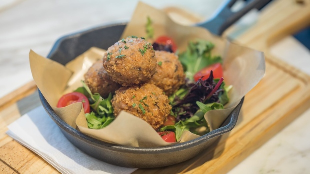 A plate of meatballs made with plant-based omnipork is arranged for a photograph at the Kind Kitchen restaurant, operated by Green Monday, in Hong Kong, China, on Thursday, June 20, 2019. After its success distributing Beyond Meat Inc.'s mock beef patties in Asia, start-up Green Monday has a new food challenge: convince Chinese consumers to try its lab-grown meatless pork. Photographer: Paul Yeung/Bloomberg