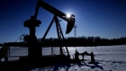 A pumpjack pumps oil from a well on a farmer's frozen field in a Pembina oil field near Pigeon Lake, Alberta, Canada. Photographer: Norm Betts/Bloomberg