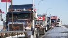 Lines of trucks block the U.S.-Canada border during a demonstration in Coutts, Alberta, Canada, on Wednesday, Feb. 2, 2022. Since Saturday, a blockade of some 100 trucks has been in place on the north side of the crossing between Alberta and Montana to protest vaccination mandates put in place this month for truck drivers going across the Canada-U.S. border, the Toronto Star reports.