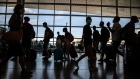 Passengers in the departures hall in El Prat airport, operated by Aena SA, in Barcelona, Spain, on Monday, Aug. 2, 2021. Nations like the U.S. and Spain have followed up their swift inoculation campaigns with a corresponding uptick in air travel. Photographer: Angel Garcia/Bloomberg