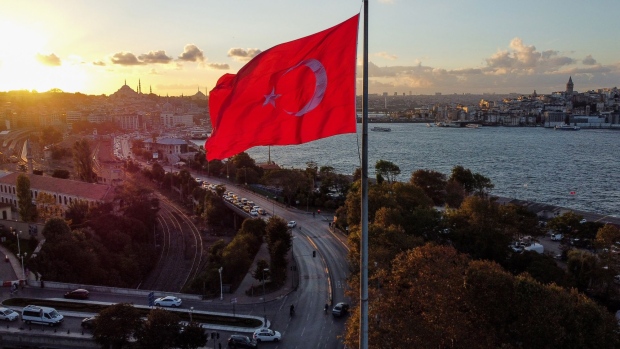 A Turkish flag by the Bosphorus strait during the evening sunset in Istanbul, Turkey, on Monday, Oct. 4, 2021. Turkey's consumer inflation accelerated in September, driven by a surge in the cost of energy.
